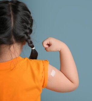 girl with bandaid on arm