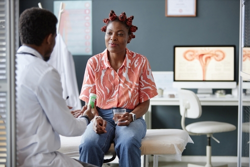 Woman receiving prescription for antibiotics in gynecologist office