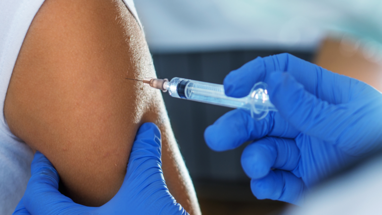 A person in South Africa, getting vaccinated